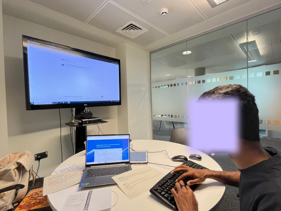 A participant interacting with a chatbot during testing session.